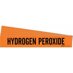 Orange adhesive pipe marker with black legend reading 'Hydrogen Peroxide'. Fits pipe outer diameters from 2-1/2 to 7-7/8 inches. Sold in a 5-pack without directional arrows. Used to identify hydrogen peroxide piping in industrial facilities, helping personnel quickly recognize pipe contents.