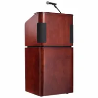 This sound lectern is constructed from laminated particle board with a mahogany finish. It includes an amplifier, a handheld microphone, and a wireless headset microphone for audio projection. A document rail is provided for holding papers. Suitable for public speaking, presentations, and events requiring amplified sound