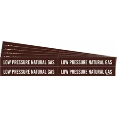 Adhesive pipe marker with brown background and white legend text reading 'Low Pressure Natural Gas'. Designed for pipe outer diameters from 3/4 to 2-3/8 inches. Sold in packs of 5. Used to identify low-pressure natural gas lines in piping systems, aiding in clear labeling for maintenance and safety.