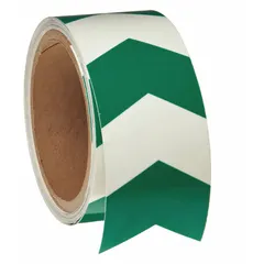 This glow-in-the-dark floor marking tape features a chevron pattern in green, made from 8 mil thick polyester with no message legend. It is used to mark pathways, exits, and hazard zones in low-light environments, providing visibility during power outages in industrial facilities.