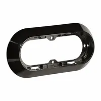 Surface mount bracket for vehicle lighting accessories. Measures 7 15/16 inches in length and 3 11/16 inches in width. Provides a secure attachment point for auxiliary, clearance, or marker lights on commercial vehicles