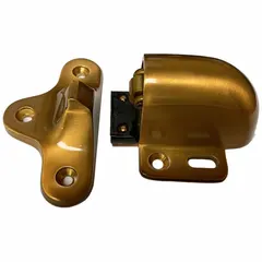 Floor-mounted catch door holder in bronze finish. Holds doors open automatically for improved traffic flow and safety. Suitable for use in commercial and industrial facilities where doors need to be secured in an open position.