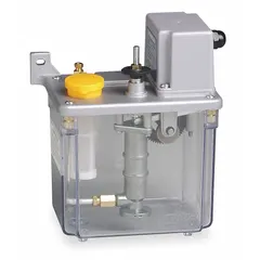Single-point automatic oil lubrication pump for machine-mount applications. Delivers up to 12 cc of oil per cycle through a 5/16 in connection. Suitable for lubricating bearings, slides, and chains on industrial equipment such as machine tools and conveyors.
