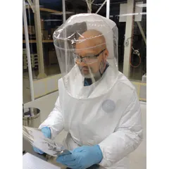 This hood-type headgear is a component of a powered air-purifying respirator (PAPR) system, supplied in a 3-pack with a universal size. It is used in healthcare and pharmaceutical settings where respiratory protection is required, providing a sealed barrier against airborne particulates and contaminants.