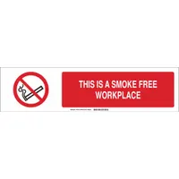 Polystyrene sign insert with white background and red legend reading 'This Is A Smoke Free Workplace'. Measures 6 in x 23-7/8 in, not retroreflective. Used with compatible sign sliders to communicate smoking policies in industrial or commercial facilities