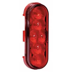 Red oval LED stop light with grommet mount and permanent installation. Features a PL-3 connector and meets SAE J2261 standards. Overall height 2 3/16 in, width 6 3/8 in. Used on heavy trucks, trailers, and commercial vehicles for brake and turn signaling.