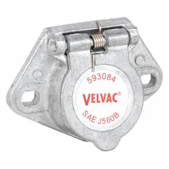 This 7-way socket connects a towing vehicle's electrical system to a trailer, powering lights, brakes, and signals. Its plastic housing and split-pin design provide secure electrical coupling for commercial trailers in fleet and vehicle maintenance applications.