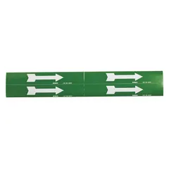 This vinyl pipe marker features a green background with white legend text to indicate directional flow. It measures 7 inches wide by 1 1/8 inches long and is non-reflective. Typically used on water or cooling lines in industrial facilities to identify pipe contents and flow direction.
