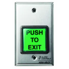 Momentary push-to-exit button for access control systems. Green actuator with green/silver housing. Dimensions: 2 3/4 in width, 2 1/4 in depth. Used to request egress from secured doors, integrating with electric strikes or magnetic locks in commercial and institutional settings.