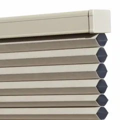 This light-filtering pull-down cellular shade is constructed of polyester with a 3/8 mm thickness. It measures 60 inches in height and 60 inches in width, finished in tan. Suitable for windows requiring light control and privacy in commercial or residential settings.