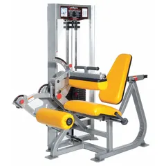 This hip and leg machine features a powder-coated steel frame in gray and orange with vinyl upholstery. Overall length is 66 inches. It is used for leg extension and curl exercises targeting quadriceps and hamstrings in commercial fitness settings.