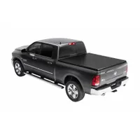 Roll-up tonneau cover made of black vinyl. Measures 85 1/2 inches in length and 6 inches in width. Features bolt-on mounting for secure attachment to the truck bed. Designed to shield cargo from weather and theft