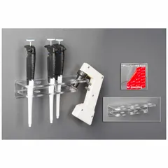 Wall-mounted pipette holder made of clear PETG. Overall height 2 1/4 in, overall length 3 5/8 in. Designed for organized storage of pipettes and pipette aids in laboratory settings.