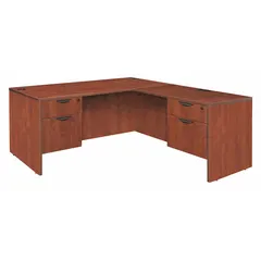 This L-shaped office desk from LEGACY features a melamine desktop and frame in a cherry finish. It includes two pedestals, two drawers, and a modesty panel, with an overall width of 71 inches. Suitable for corner configurations in professional workspaces, it provides ample surface area and storage for office tasks.