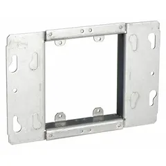 Steel plaster ring with blank cover, 3/4 in raised height, 7.06 in length, 4.5 in width. Used to enclose electrical boxes in walls or ceilings, providing a flush or raised mounting surface or a blank closure.