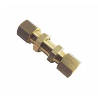 This brass compression fitting connects two 16 mm OD tubes in a compression-to-compression configuration. It is used in industrial fluid-handling systems for pneumatic, hydraulic, or instrumentation lines where a leak-tight, removable joint is required without threading or welding
