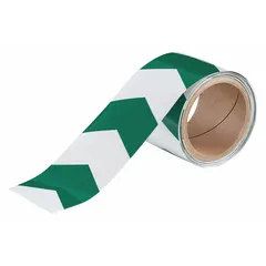 This glow-in-the-dark floor marking tape features a chevron pattern in green, made from 8 mil thick polyester with no message legend. It is used to mark pathways, exits, and hazard zones in low-light industrial environments, providing visibility during power outages.