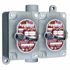 Two-gang front lever tumbler switch rated 20 A at 277 V AC. 4-way switching configuration with 3/4 in feed-thru hub. Used for controlling lighting or other loads from multiple locations in industrial and commercial installations.
