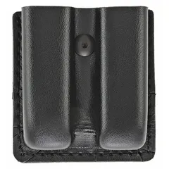 This duty equipment pouch is constructed from synthetic leather with a plain finish. It measures 3 1/2 inches by 7/8 inches and features an open closure for quick access. Commonly used for storing magazines on a belt or vest in tactical and security applications.