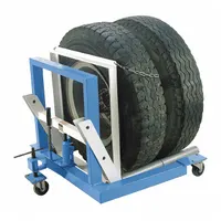 Hydraulic dual-wheel dolly with a 4° tilt for positioning and aligning heavy dual-wheel assemblies. Maximum lift height of 5 in and weight capacity of 1,500 lb. Used in fleet maintenance and heavy equipment servicing to lift and move dual wheels