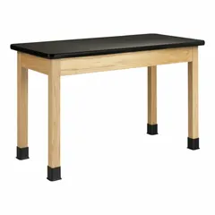 Fixed-height lab table with a black laminate countertop and oak wood apron. Overall height 30 inches, length 4 feet. Suitable for educational, laboratory, and light industrial settings as a stable work surface for experiments, assembly, or computer stations.