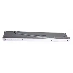 This Grade 1 heavy-duty concealed-mount door closer is constructed of aluminum and features a track arm with adjustable spring size 5. It is designed for interior or exterior use on commercial or industrial openings, providing controlled door closing. The unit is ADA compliant and measures 22 1/2 in length by 3 3/4 in width.