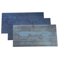 This 6-piece shim stock assortment consists of Grade 1095 plain steel shims, each 12 inches long and 6 inches wide. Width tolerance is +/-0.005 in, thickness tolerance is +/-0.00075 in, and length tolerance is +0.125/-0.000 in. Used for precision alignment, gap filling, and leveling in industrial machinery and equipment.