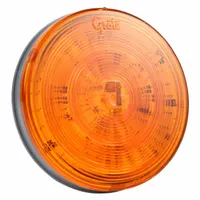 LED turn signal light with amber round lens, 4 5/16 in overall diameter. Features grommet mount for permanent installation and female pin electrical connection. Complies with FMVSS 108 standards. Suitable for use on trucks, trailers, and heavy equipment to indicate turning