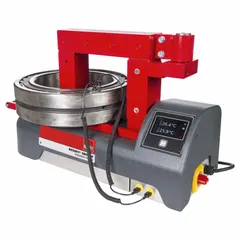 Portable induction bearing heater from the SBH series, featuring a cross-bar design. Operates at 480V and 16 A. Suitable for heating bearings with a 1 5/16 in bore to facilitate thermal expansion for shaft installation. Used in maintenance and assembly applications.