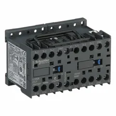 This SCHNEIDER miniature reversing IEC contactor is rated at 6 A with 3 poles and 3 normally open contacts. It operates with a 240V AC coil and does not include integrated surge suppression. Typical applications include controlling forward and reverse rotation of three-phase motors in industrial equipment such as conveyors, pumps, and hoists.