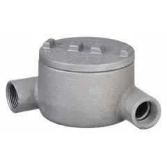 This UL 886-listed N round body 90° elbow conduit outlet body is made of aluminum with a powder-coated finish. It has a 1 in trade size, threaded female hubs for use with threaded IMC, and includes a cover and grounding screw. Suitable for hazardous locations, it provides a pulling point or access for wire installation.