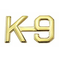 Metallic rank insignia featuring a K-9 design in gold finish. Measures 1/2 inch and attaches via clutch pin. Suitable for uniform wear on caps, collars, or lapels to indicate canine-handler roles
