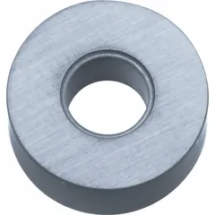 This round indexable turning insert is made of cermet, a material combining ceramic and metallic properties for wear resistance and edge strength. It is used for finish machining of steels and cast irons in turning, facing, and profiling operations, providing a smooth cutting action and improved surface finish.