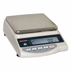 Electric-powered industrial balance with 0.1g readability and weighing in pennyweight (dwt) units. Integrated design measures 6 1/4 in x 7 in. Not IP rated and not washdown rated, suitable for dry indoor environments such as jewelry, precious metals, and laboratory weighing applications.