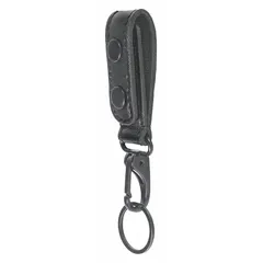 This leather key holder features a snap closure and measures 6 1/4 inches by 29 mm, fitting belts up to 2 1/4 inches wide. The plain black design provides a secure way to carry and organize keys on a belt, suitable for industrial or maintenance environments where hands-free access is needed.