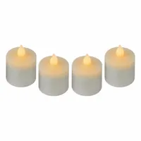 White plastic tealight with amber light color, 1 3/4 in height and 1 1/2 in width. Designed for use in flameless inside lamps, providing a safe alternative to open flames