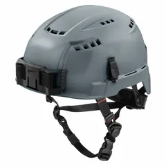 This Type 2, Class C climbing helmet is constructed from polyethylene in a solid gray finish with no graphics. It features a ratchet suspension adjustment for secure fit and a headlamp mount for accessory integration. Suitable for work-at-height applications such as construction, industrial maintenance, and utility work.