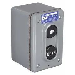 This control station features two black push buttons with Up/Down legends and 2 normally open (2NO) contacts. It is used for momentary directional commands in industrial applications such as hoists, conveyors, and lift systems.