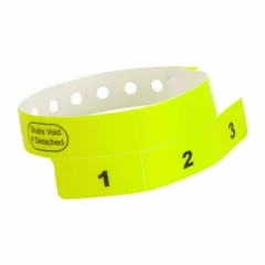 Yellow vinyl wristband with 'Stubs Void If Detached' security feature. Overall length 10 inches, width 3/4 inch. Pack of 500. Used for access control and identification at events, hospitals, and industrial facilities.