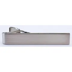 Metal tie clip, collar pin, and shirt keeper with a nickel finish. Measures 5/16 in x 2 in. Secures neckties to dress shirts, keeping the tie straight and centered against the placket for a professional appearance in business or formal settings.