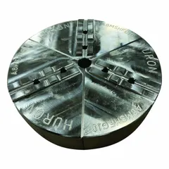 This HURON full-grip lathe jaw is constructed from aluminum to reduce workpiece marking. It features a round tongue-and-groove design for precise alignment and repeatability. Designed for use with a 6-inch chuck, it has a 4-inch height and a 3/8-inch mounting bolt size. Suitable for turning, facing, and boring operations.