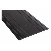 This 6 ft aluminum saddle threshold features a fluted transition surface. It is used to bridge the gap under a door, providing a smooth transition between different flooring materials and helping to seal against drafts and debris