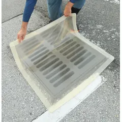 This self-sealing drain cover seal from ULTRATECH is a clear, circle-shaped polyurethane cover with a 42-inch diameter and 3/8-inch thickness. It is designed to fit drains up to 36 inches in diameter, providing a seal to contain spills, control vapors, and prevent debris from entering drain systems during maintenance or operations in industrial and commercial settings.