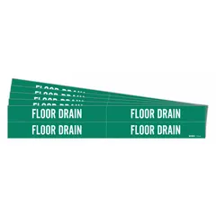 Green adhesive pipe markers with white 'Floor Drain' legend, designed for pipes with an outside diameter of 3/4 to 2-3/8 inches. Each pack contains 4 markers without arrows. Used to identify floor drain pipes in industrial facilities for maintenance and safety.