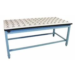 Laminate workbench with ball transfer surface for smooth movement of heavy items. Fixed height, 72 in x 36 in work area. Overall load capacity of 1,000 lb. Blue finish. Suitable for assembly, inspection, and light industrial tasks.