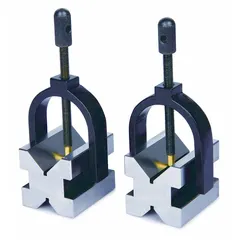 This pair of steel V-blocks features magnetic bases for secure workpiece holding. Each block measures 2 in x 1 5/8 in x 1 5/8 in and is precision ground to ASME Grade 0. Used in machining and inspection to align cylindrical parts for drilling, milling, or measuring.