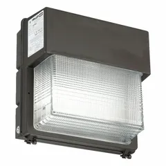 This full-size wall pack uses a 150 W high-pressure sodium lamp and operates on 120 to 277V AC. It is suited for outdoor area lighting such as building perimeters, parking lots, and walkways. The fixture has an overall height of 14 inches.