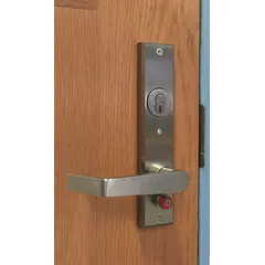 Classroom security lever lockset constructed from satin stainless steel. ADA compliant and equipped with an SFIC core. Includes a Spell M Escutcheon with no message. Suitable for educational facilities requiring keyed access control.
