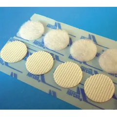 Pre-cut hook-and-loop disc made of white nylon with an adhesive backing. Overall diameter of 3/4 in. Used for quick, removable fastening in light-duty industrial, packaging, and assembly applications such as organizing cables, mounting lightweight components, or securing temporary fixtures.