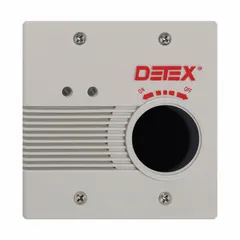 This standard door alarm is powered by an electrically corded 24 V AC connection and features a mortise cylinder. The gray plastic alarm body emits a horn sound at 100 dB. Typical applications include securing emergency exits in commercial and industrial facilities, deterring unauthorized use while allowing safe egress.